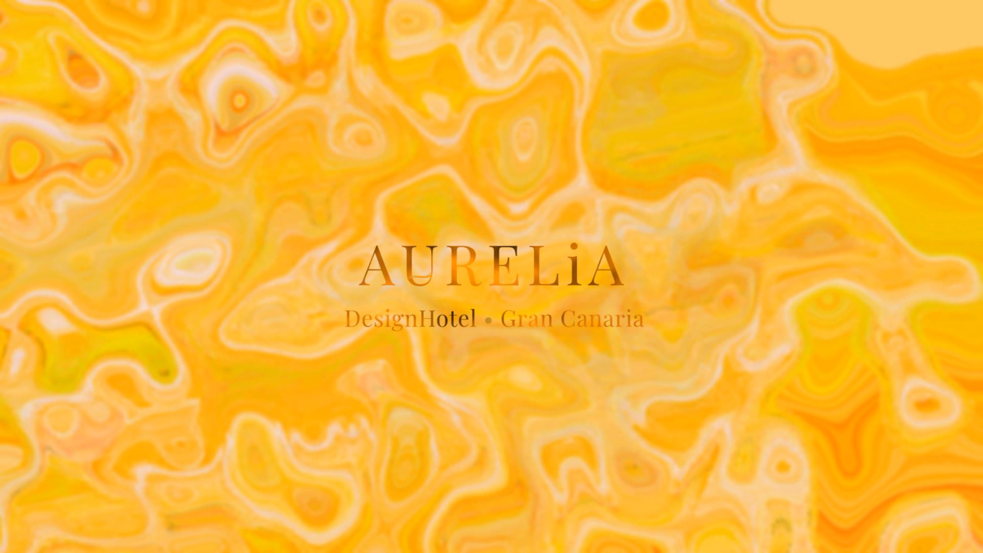 The Aurelia — golden ambient loop as it appears on a hotel lobby screen